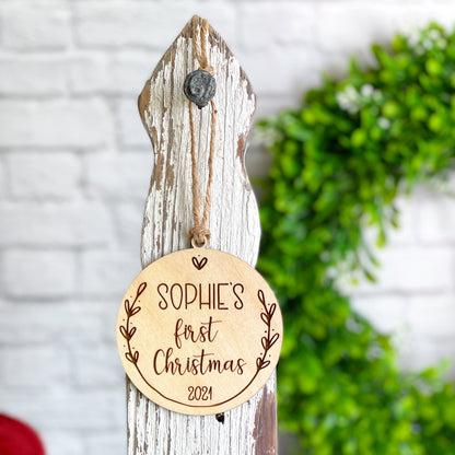 Baby's first Christmas engraved keepsake wooden ornament, customizable with first name and year